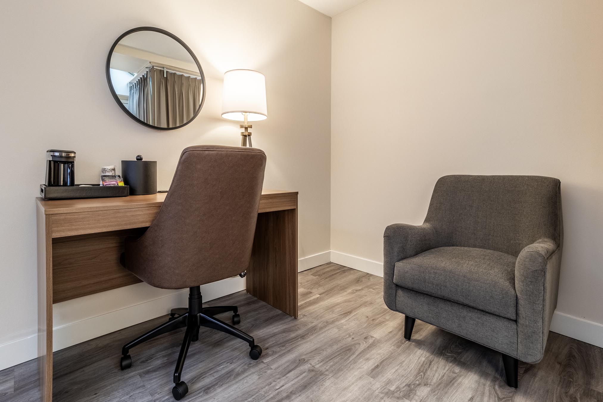 desk with chair next to larger comfy chair