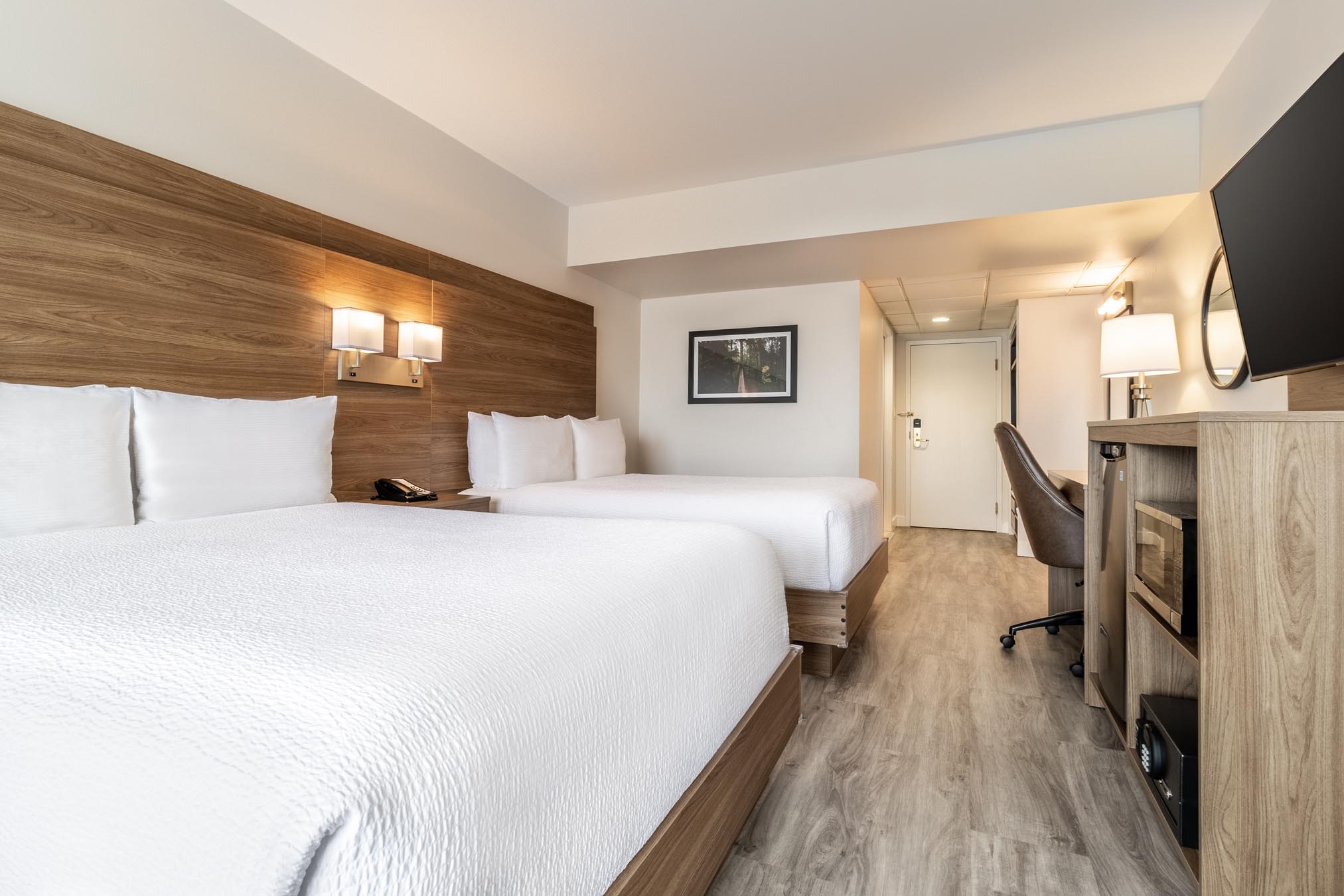 Hotel room with two beds facing television