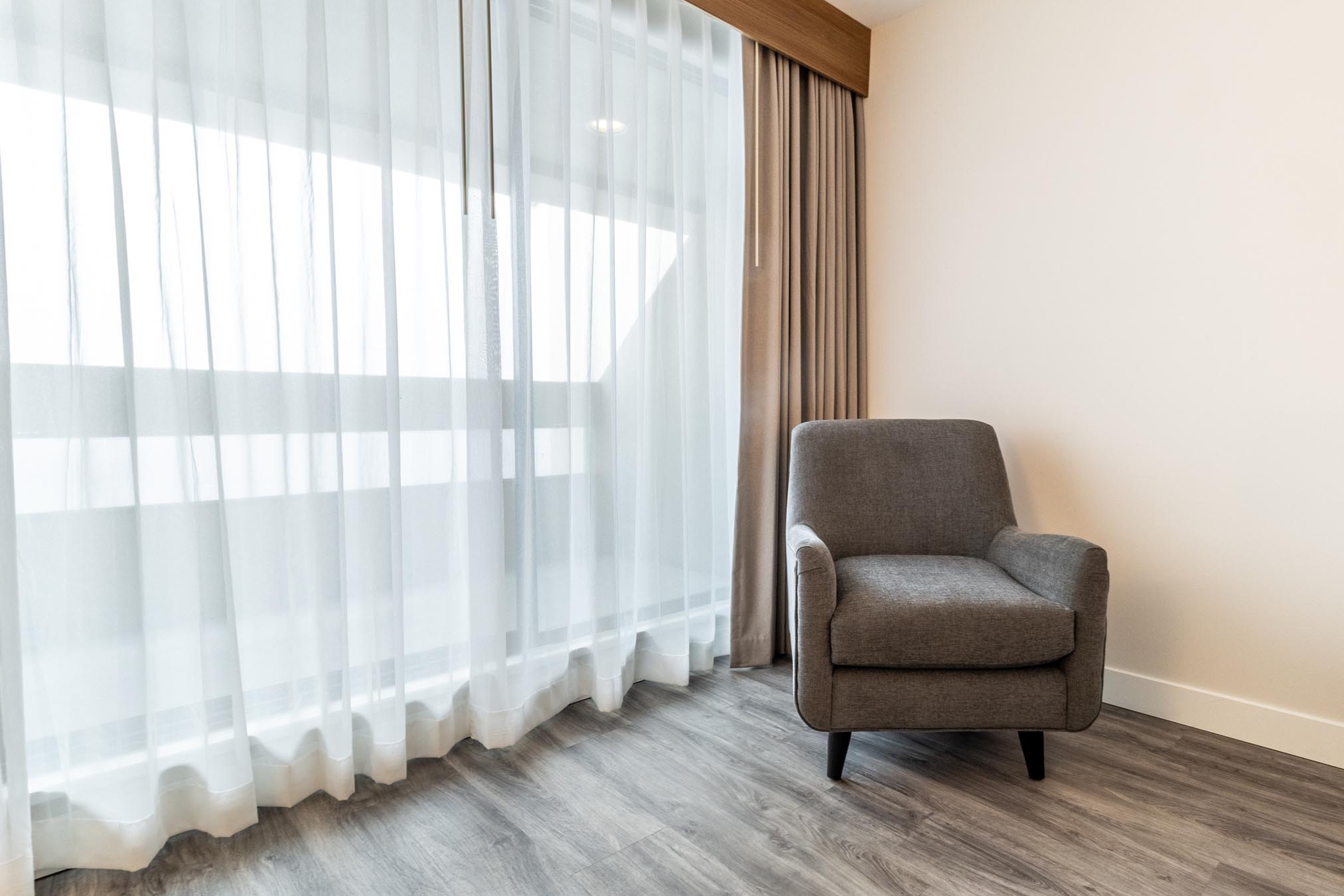 Chair in hotel room next to window